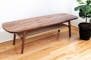 Mid century walnut coffee table, danish cord lower shelf, splayed legs, overall view