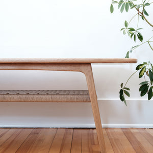 Mid century white oak coffee table, danish cord lower shelf, splayed legs, detail view